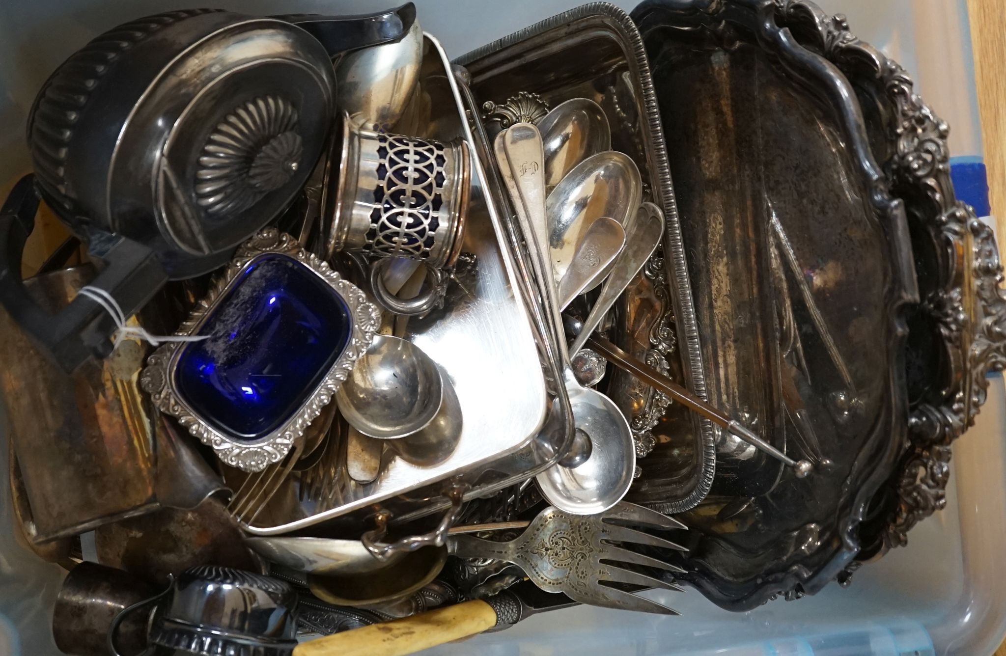 A group of plated wares to include two salvers, mustard pots etc.